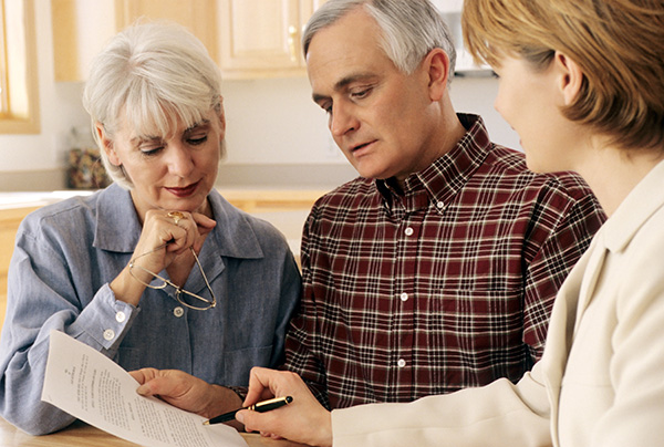 Senior couple meeting with financial agent